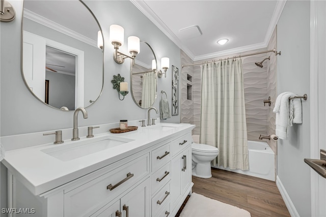5548 Foxhunt Way, Naples, FL 34104 - full bath with double vanity, shower / bath combo with shower curtain, wood finished floors, toilet, and crown molding