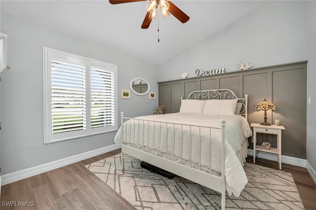 5548 Foxhunt Way, Naples, FL 34104 - bedroom with lofted ceiling, wood finished floors, ceiling fan, and baseboards