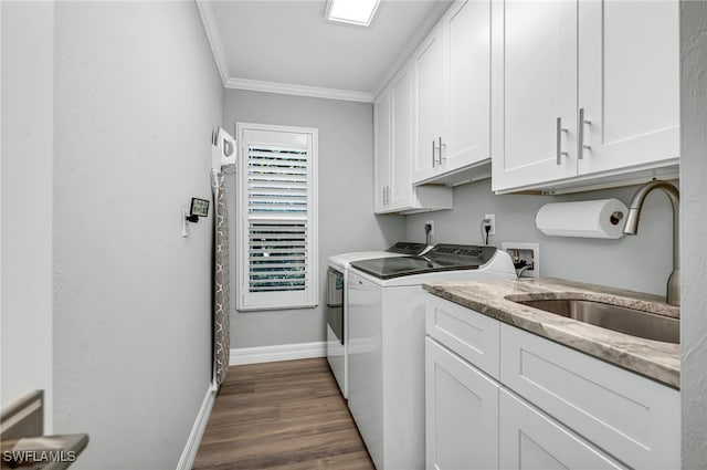 5548 Foxhunt Way, Naples, FL 34104 - laundry room featuring washer and clothes dryer, ornamental molding, baseboards, cabinet space, and dark wood-style flooring
