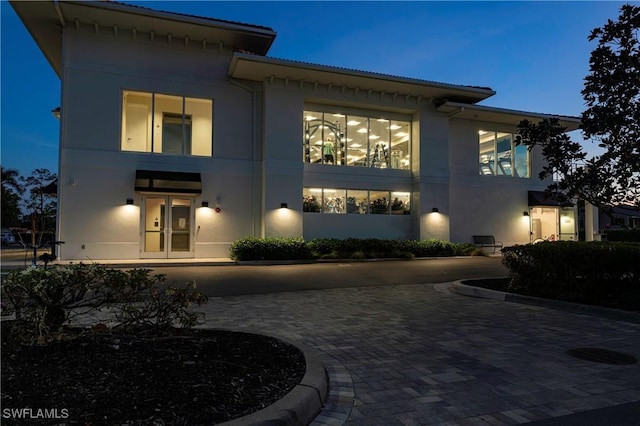 5548 Foxhunt Way, Naples, FL 34104 - rear view of property with stucco siding