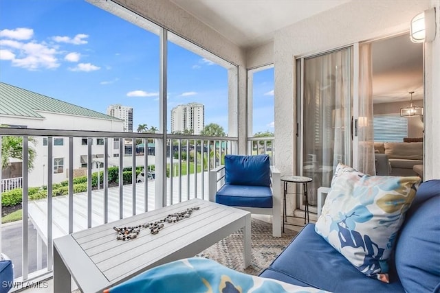 sunroom / solarium with a city view