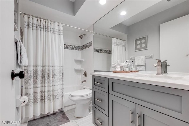 full bath with toilet, shower / bathtub combination with curtain, and vanity