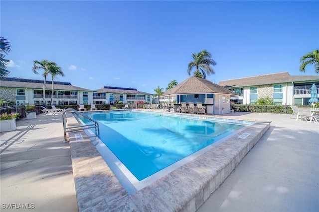 view of swimming pool featuring a patio