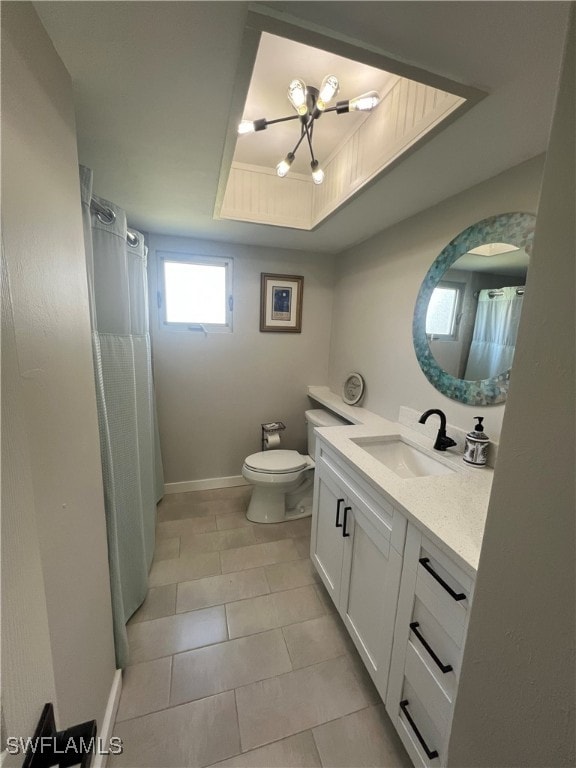 3680 Woodstork Ct, Fort Myers, FL 33908 - full bathroom with vanity, baseboards, tile patterned floors, toilet, and a raised ceiling