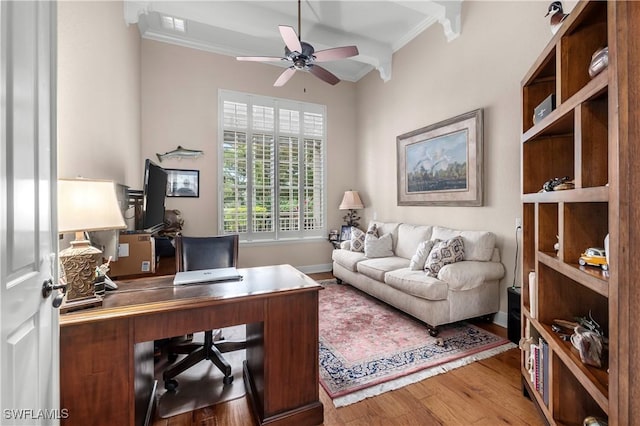 office featuring ceiling fan, ornamental molding, and hardwood / wood-style floors