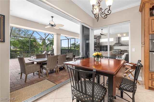 dining room with ceiling fan with notable chandelier, ornamental molding, and light tile patterned flooring