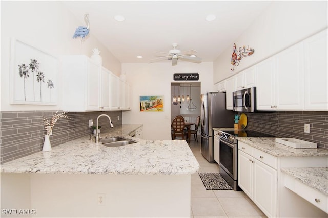 10007 Sky View Way Unit 2005, Fort Myers, FL 33913 - kitchen featuring appliances with stainless steel finishes, ceiling fan, decorative backsplash, white cabinets, and recessed lighting