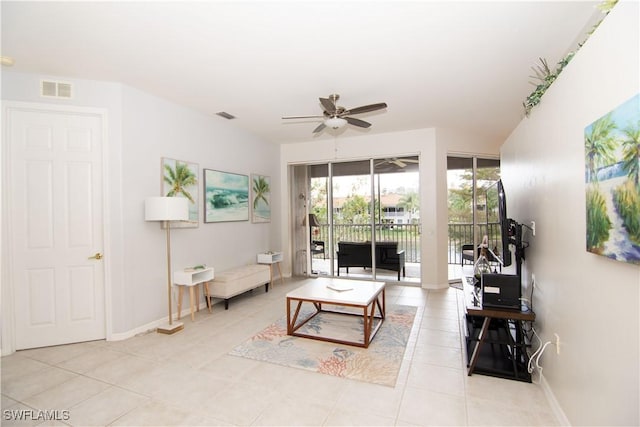 living room featuring ceiling fan and light tile patterned floors