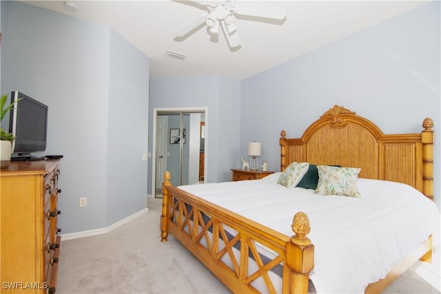 bedroom with light colored carpet and ceiling fan