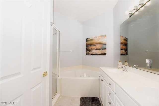 bathroom featuring shower with separate bathtub, tile patterned floors, and vanity