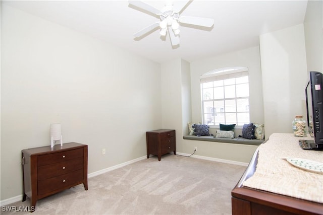 bedroom with light carpet and ceiling fan