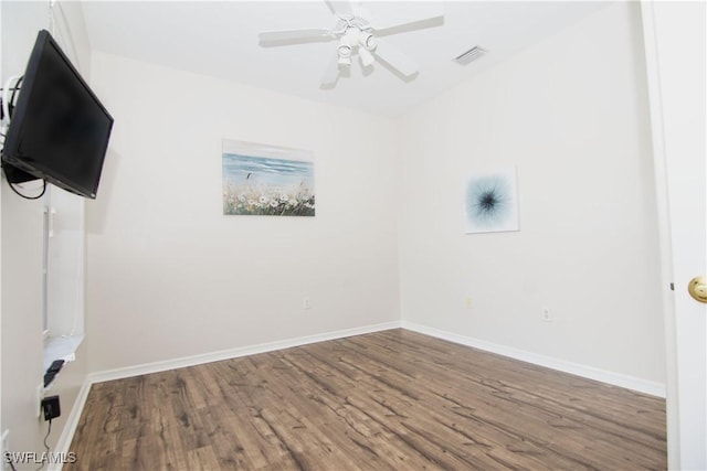 unfurnished room with ceiling fan and hardwood / wood-style floors