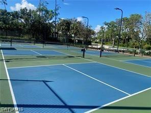 10007 Sky View Way Unit 2005, Fort Myers, FL 33913 - view of tennis court featuring community basketball court