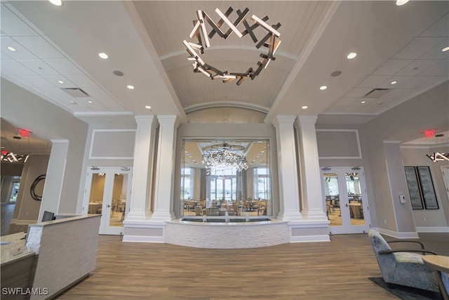10007 Sky View Way Unit 2005, Fort Myers, FL 33913 - foyer featuring decorative columns, french doors, a chandelier, ornamental molding, and recessed lighting