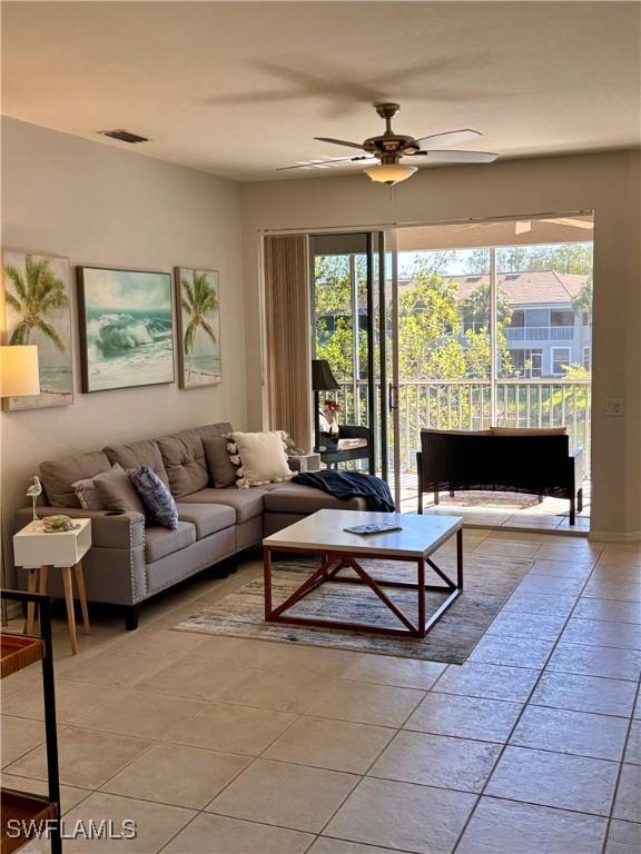 10007 Sky View Way Unit 2005, Fort Myers, FL 33913 - living area with a ceiling fan and light tile patterned floors