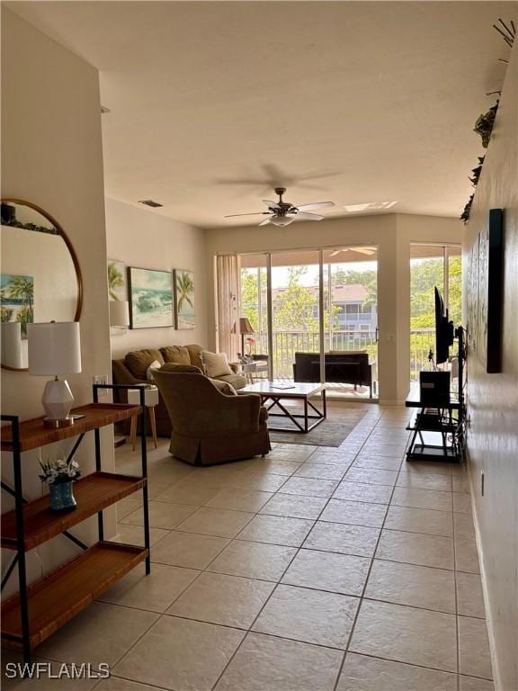 10007 Sky View Way Unit 2005, Fort Myers, FL 33913 - living area with light tile patterned flooring and ceiling fan