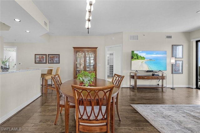 dining space with recessed lighting, dark wood-type flooring, baseboards, and visible vents