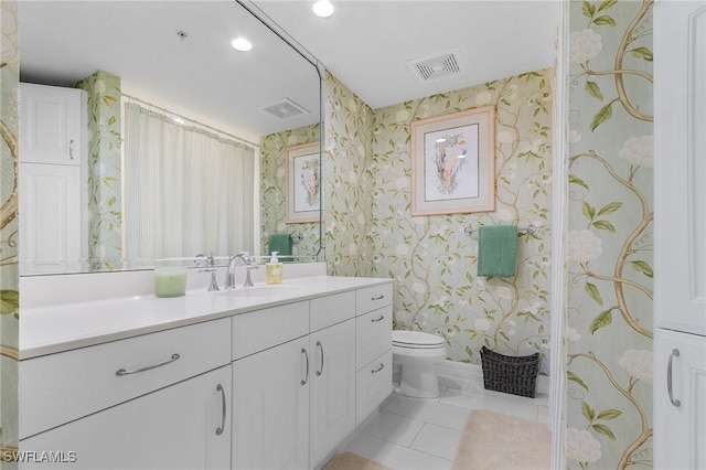full bath with wallpapered walls, vanity, toilet, and visible vents