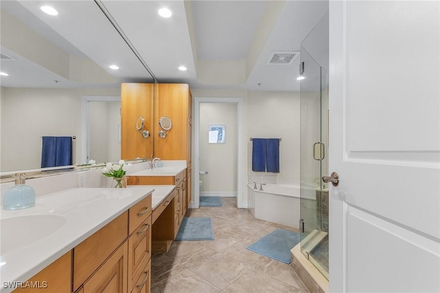 full bathroom featuring a bath, visible vents, double vanity, recessed lighting, and a stall shower