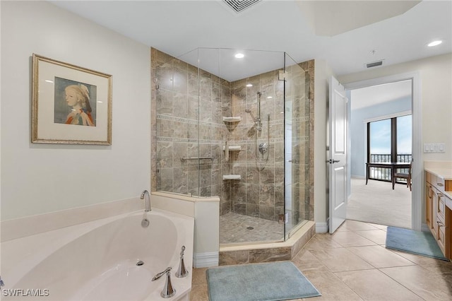full bath with vanity, a bath, visible vents, and a shower stall