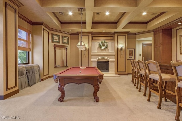 recreation room with coffered ceiling, light colored carpet, crown molding, and a fireplace with raised hearth