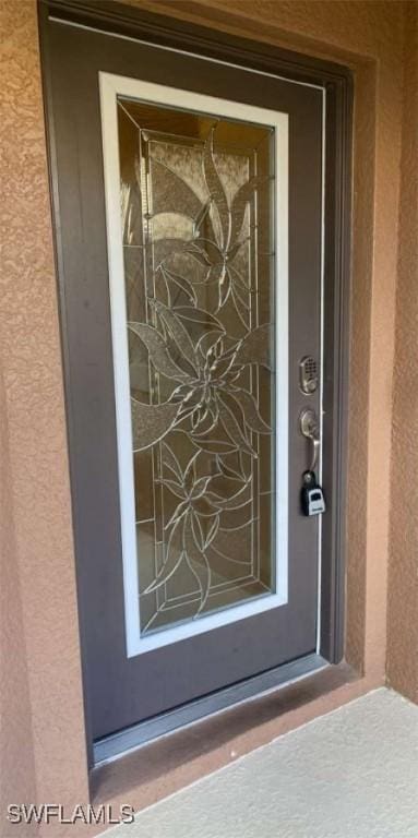 13772 Cleto Dr, Estero, FL 33928 - property entrance featuring stucco siding