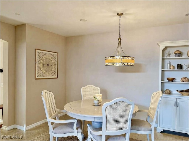 13772 Cleto Dr, Estero, FL 33928 - dining space with light tile patterned floors and baseboards