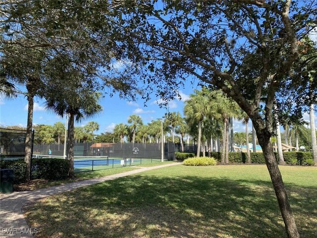 13772 Cleto Dr, Estero, FL 33928 - exterior space featuring a lawn and fence