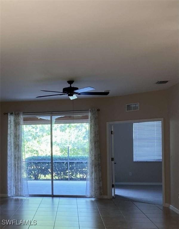13772 Cleto Dr, Estero, FL 33928 - tiled spare room with ceiling fan, visible vents, and baseboards