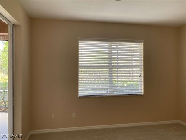 13772 Cleto Dr, Estero, FL 33928 - carpeted empty room featuring baseboards