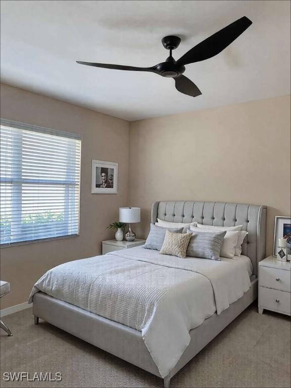 13772 Cleto Dr, Estero, FL 33928 - bedroom with baseboards, ceiling fan, and light colored carpet