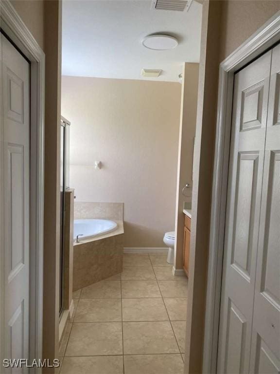 13772 Cleto Dr, Estero, FL 33928 - full bath with tile patterned floors, toilet, vanity, a shower stall, and a bath