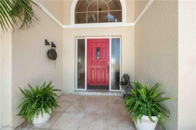 property entrance featuring stucco siding