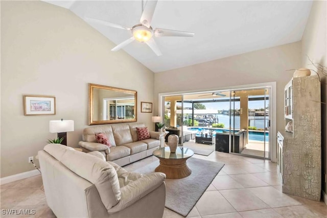 living room with light tile patterned floors, a sunroom, ceiling fan, high vaulted ceiling, and baseboards