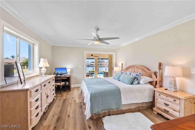 bedroom with light wood-style floors, access to outside, multiple windows, and crown molding