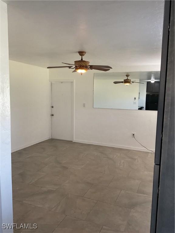 unfurnished room featuring ceiling fan