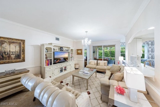 tiled living room featuring crown molding and a notable chandelier