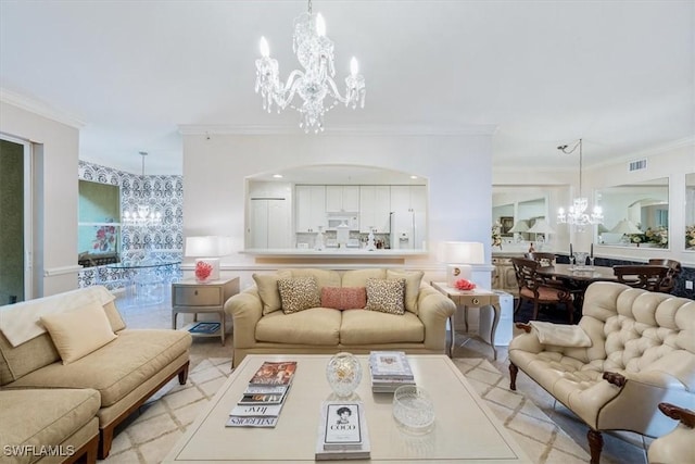 living room with ornamental molding and a notable chandelier