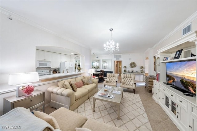 tiled living room with ornamental molding and an inviting chandelier