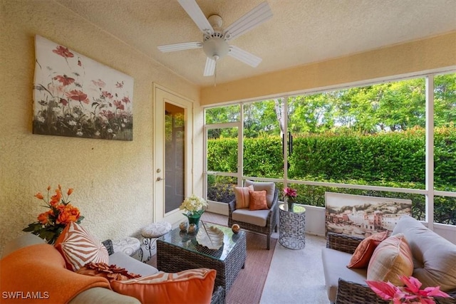 sunroom / solarium featuring ceiling fan and a healthy amount of sunlight