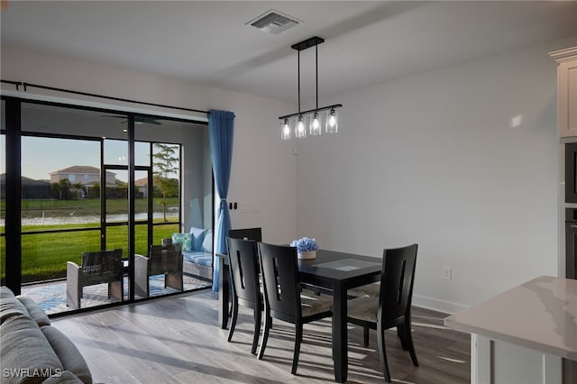 dining area with light wood-type flooring