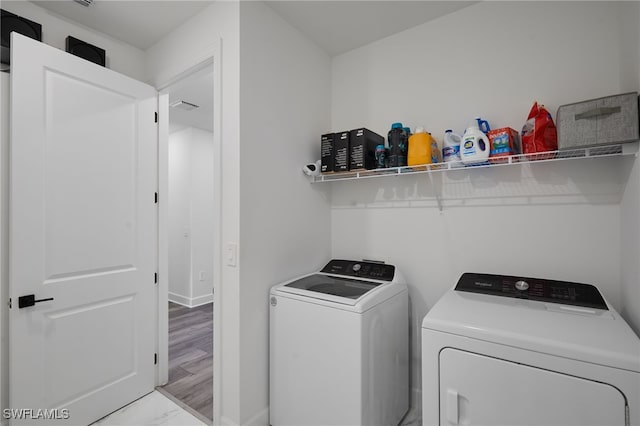 laundry room with independent washer and dryer