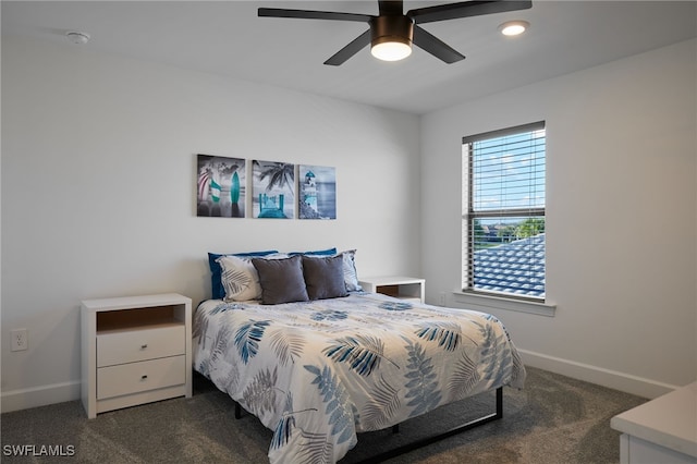 bedroom with dark carpet and ceiling fan