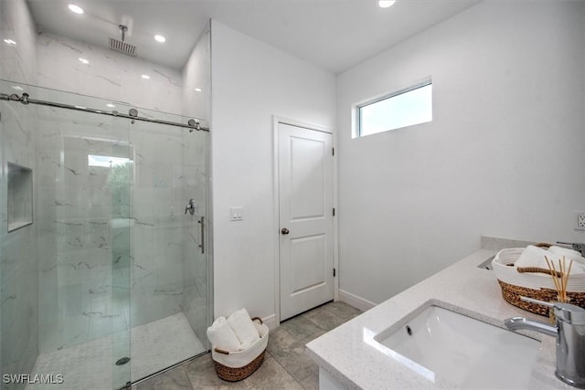 bathroom featuring an enclosed shower and vanity