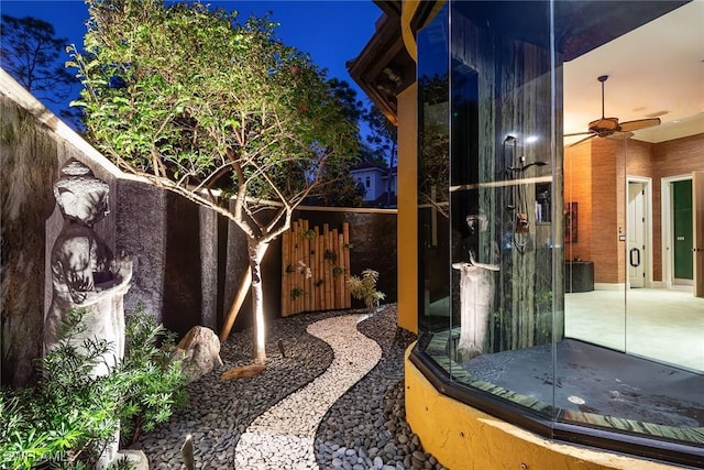 view of yard with a patio and ceiling fan