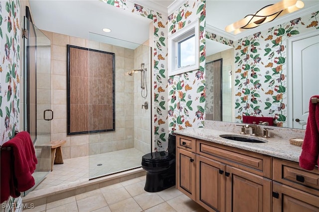 bathroom with toilet, a shower with shower door, tile patterned floors, ornamental molding, and vanity