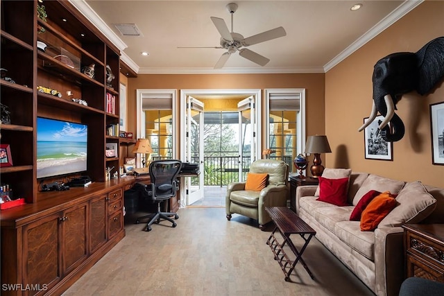 office area featuring ceiling fan, ornamental molding, and built in desk