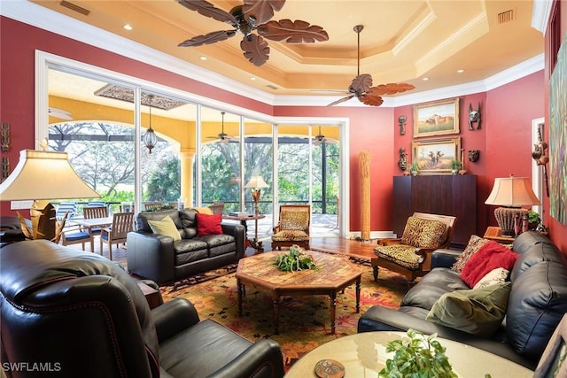 sunroom / solarium featuring ceiling fan and a tray ceiling