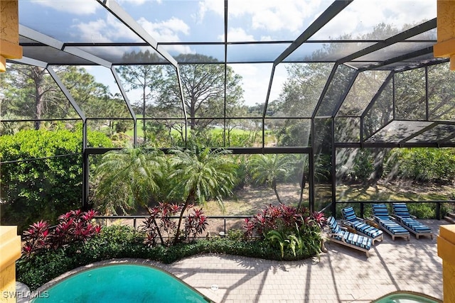 view of patio / terrace with glass enclosure