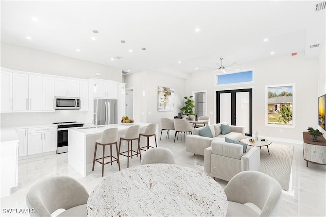 living room featuring ceiling fan